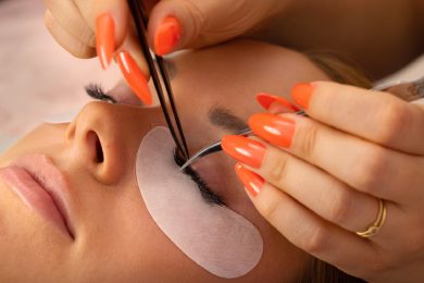 Detailed view of lash extension application process.